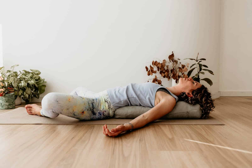Restorative yoga pose with bolster support for deep relaxation and calm by LionHeartCircle